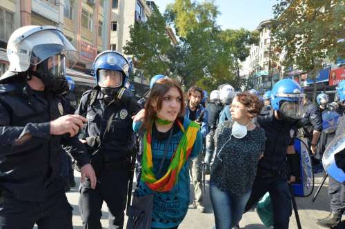Policemen arrest protestors in Ankara, capital of Turkey, on Oct. 7, 2014. Turkish authorities imposed a curfew in five provinces after at least 12 people were killed during anti-Islamic State (IS) protests, local news agency Dogan reported Wednesday. The curfew was declared in the southeastern provinces of Mardin, Van, Siirt, Batman and Diyarbakir in an effort to disperse demonstrations against the advance of IS militants into Kurdish populated Kobane town in northern Syria.