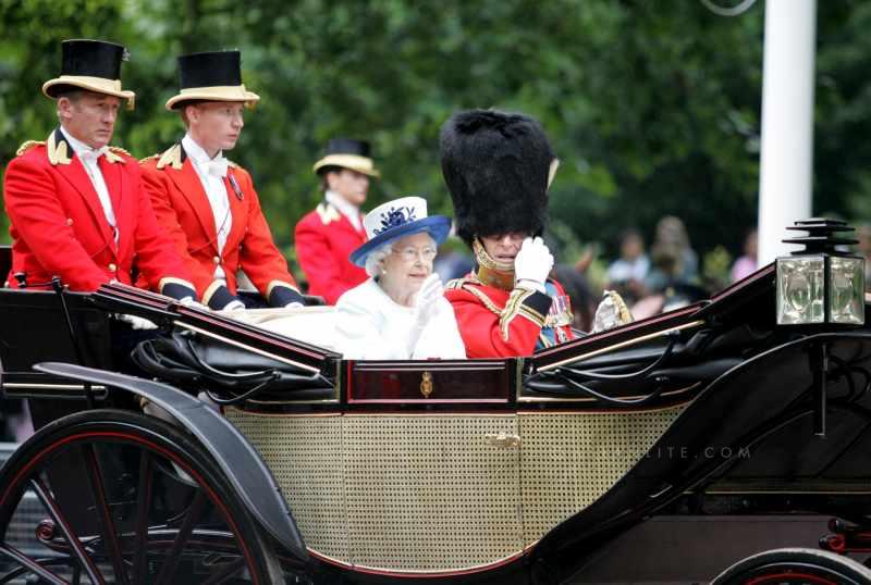  Britain's Queen Elizabeth II (L) and her husband Prince Philip attend Trooping the Colour in London on June 14, 2014. The ceremony of Trooping the Colour is to celebrate the Sovereign's official birthday. 