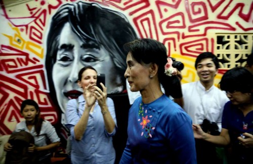 Aung San Suu Kyi  leader of Myanmar's National League for Democracy (NLD), leaves after a press conference at the party heardquarters in Yangon, Myanmar