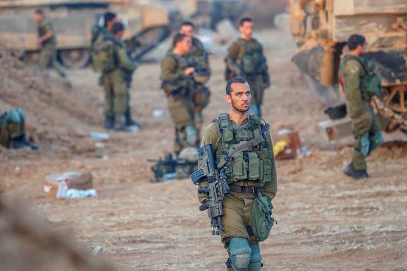  Israeli soldiers from the Golani Brigade are seen at a staging area before entering Gaza from Israel