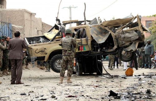 Afghan security forces transfer a destroyed military vehicle following a blast in Nangarhar province in east Afghanistan on Dec. 21, 2014. Earlier on Sunday, one soldier and a civilian were killed and five people wounded in two separate IED blasts in Jalalabad city, the provincial capital of Nangarhar province, police said. 