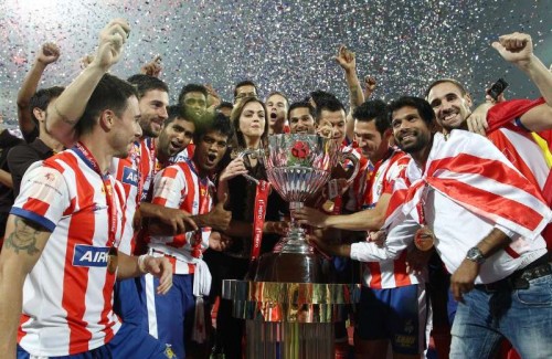 Atletico de Kolkata players celebrates after defeating Kerala Blasters FC to clinch the first ISL trophy at at D.Y Patil Stadium, in Mumbai on Dec 20, 2014. 