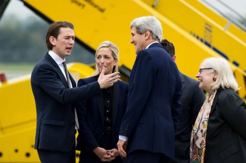 U.S. Secretary of State John Kerry  talks with Austrian Foreign Minister Sebastian Kurz at Vienna International Airport, Austria, on Oct. 15, 2014. Iran and six powers are set to start another round of nuclear talks in Vienna .FILE PHOTO