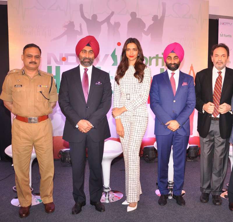 Actress Deepika Padukone with Dr. Prannoy Roy, Founder & Executive Co-Chairperson, NDTV Malvinder Mohan Singh, Executive Chairman, Fortis Healthcare, and Shivinder Mohan Singh, Executive Vice-Chairman, Fortis Healthcare and others at the launch of `NDTV Fortis Health4U` campaign in New Delhi on Sept 12, 2014. (Photo: IANS)