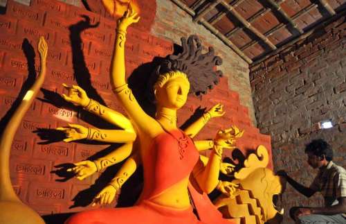 An artist busy working on a Durga idol ahead of Durga Puja in Kolkata