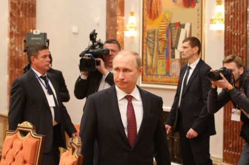  Russian President Vladimir Putin  arrives for the four-way peace talks on the Ukraine crisis in Minsk, Belarus, on Feb. 11, 2015. Four-way peace talks on the Ukraine crisis resumed here Wednesday in the Belarusian capital as heads of state and government of Russia, France, Germany and Ukraine were joined by their respective entourages. 