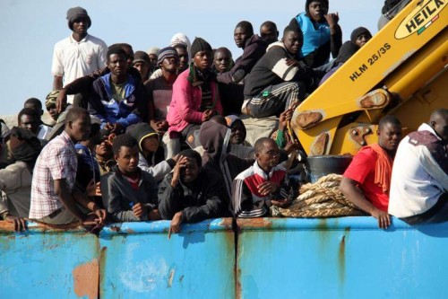 A Libyan coastguard boat carrying mostly African illegal migrants arrives at the port in the city of Misrata, Libya, on May 3, 2015, after the coastguard intercepted five boats carrying around 500 people trying to reach Europe. 