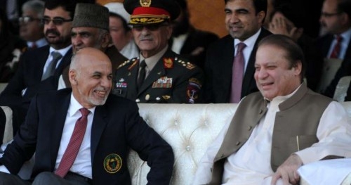 Pakistani Prime Minister Nawaz Sharif (front R) talks with Afghan President Ashraf Ghani (front L) as they watch a cricket match between Pakistan and Afghanistan in Islamabad, capital of Pakistan on Nov. 15, 2014. 