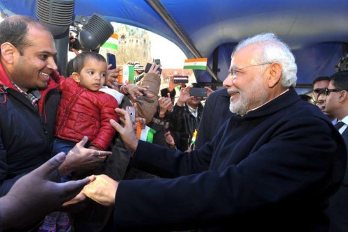 Prime Minister Narendra Modi being greeted by the members of the Indian community on his arrival in Hannover, Germany on April 12, 2015.