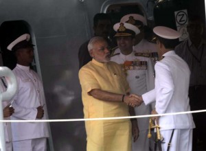 Prime Minister Narendra Modi with Admiral RK Dhowan, Chief of Naval Staff during the commissioning ceremony of INS Kolkata at the Naval Dockyard in Mumbai on August 16, 2014. (Photo: Sandeep Mahankal/IANS)