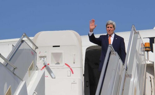  US Secretary of State John Kerry waves before his departure from Ahmedabad on Jan 12, 2015. 