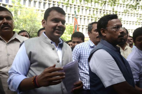 Mumbai: Maharashtra BJP chief Devendra Fadnavis, party leader Vinod Tawde and other newly-elected legislators of BJP arrive to attend a meeting to elect new BJP Legislature Party leader, in Mumbai, on Oct.28, 2014. Union Home Minister Rajnath Singh, senior party leaders Rajiv Pratap Rudy, O.P. Mathur and J.P. Nadda will oversee the election.