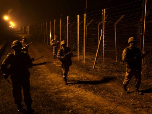  Soldiers on patrol duty along Indo-Pak border in Samba district of Jammu and Kashmir on Jan 6, 2015. 