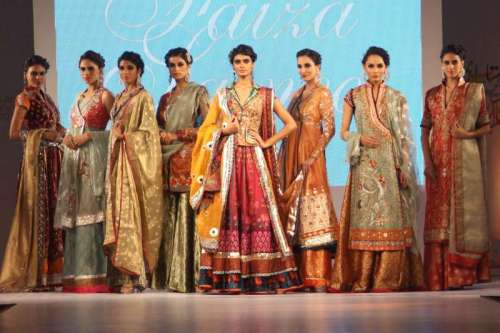 Models walk the ramp during a fashion show ahead of Aalishan Pakistan - a four-day-long lifestyle exposition organised by the Federation of Indian Chambers of Commerce and Industry (FICCI) and Trade Development Authority of Pakistan in New Delhi on Sept 10, 2014. (Photo: Amlan Paliwal/IANS)