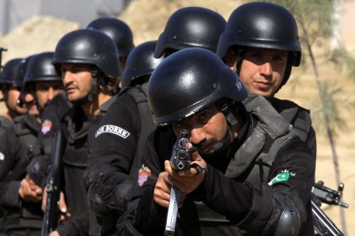 Pakistani police commandos demonstrate their skills during a special elite police training course at a police training centre in northwest Pakistan's Nowshera on Feb. 11, 2015. About 35 female and 150 male commandoes demonstrated skills during a commando training course in Nowshera. 