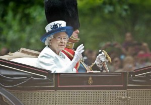 Britain's Queen Elizabeth II  and her husband Prince Philip attend Trooping the Colour in London on June 14, 2014. The ceremony of Trooping the Colour is to celebrate the Sovereign's official birthday. 