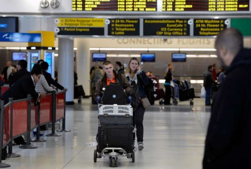 Passengers walk in the JKF International Airport in New York, the United States. New York State.