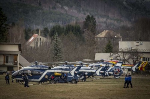 French gendarmes walk in the rescue base camp in the Alps in southern France, March 25, 2015. French gendarmes late Tuesday found one of the two black boxes of the German passenger plane that crashed in southern France with 150 people on board, while a joint international probe into the cause of the accident is under way.