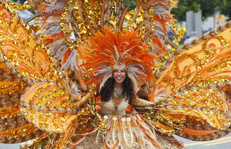  A girl performs with her float during the Junior Parade of the 2014 annual Toronto Caribbean Carnival in Toronto, Canada, July 19, 2014. As the largest Junior Parade of its kind in North America, this annual event kicked off here on Saturday