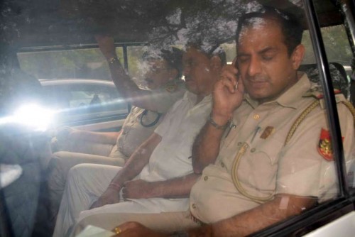 Delhi Law Minister Jitender Singh Tomar being taken to be produced at Saket Court in New Delhi on June 9, 2015. 