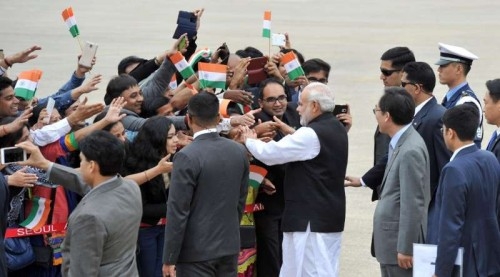 Prime Minister Narendra Modi greeted by the people on his arrival, at ROK Airbase, in Seoul, South Korea on May 18, 2015. 