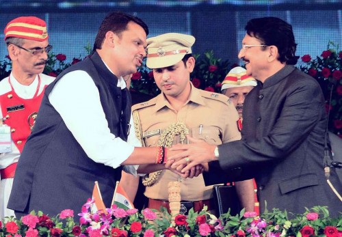 Mumbai: Maharashtra Chief Minister Devendra Fadnavis and Maharashtra Governor Chennamaneni Vidyasagar Rao during the swearing-in ceremony of the former at Wankhede Stadium in Mumbai, on Oct.31, 2014. 