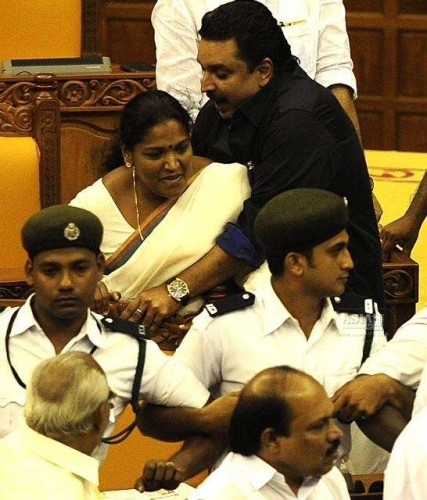 Kerala legislators go berserk in the state assembly during the budget session in Thiruvananthapuram on March 13, 2015. 