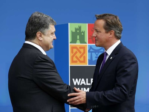 Ukrainian President Petro Poroshenko shakes hands with British Prime Minister David Cameron at the NATO Summit 2014 in Newport, Wales, the United Kingdom. The two-day NATO Summit 2014 kicked off in Wales