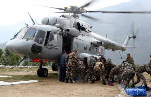 Relief materials being unloaded from a Indian Air Force's Mi-17 chopper  in quake-hit  Nepal. 