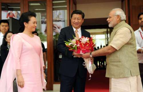 Prime Minister Narendra Modi greets Chinese President Xi Jinping, on his arrival in Ahmedabad, Gujarat 