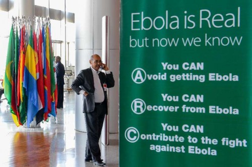  A man calls beside a poster with the theme of anti-Ebola Virus at the headquarters of African Union (AU) in Addis Ababa, Ethiopia, Jan. 27, 2014. The 22nd African Union summit is scheduled to be opened here on Jan. 30, 2015. 