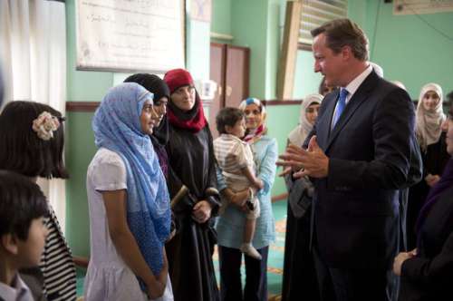 Prime Minister David Cameron interacting with Muslim students during a mosque visit in Manchester 