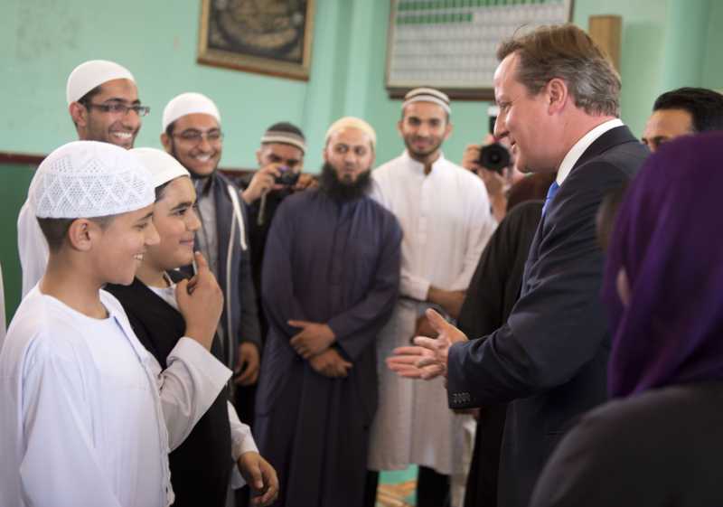 Prime Minister Cameron interacting with Muslim children during a mosque visit