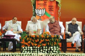 Former BJP President and Union Home Minister Rajnath Singh, Prime Minister Narendra Modi, Newly appointed BJP President Amit Shah and Senior BJP leader L K Advani at the BJP National Council meeting in New Delhi on Aug 9, 2014. (Photo: IANS)
