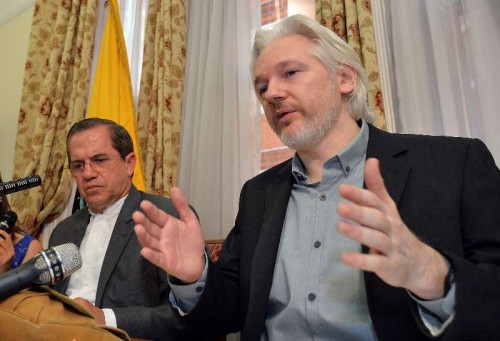 WikiLeaks founder Julian Assange  and Ecuadorian Foreign Minister Ricardo Patino attend a press conference at the Ecuadorian Embassy in London, Britain, Aug. 18, 2014. WikiLeaks founder Julian Assange said on Monday that he would be leaving the Ecuadorian Embassy in London soon, where he had taken refuge for two years. (Xinhua/Press Association/John Stillwell) (srb)