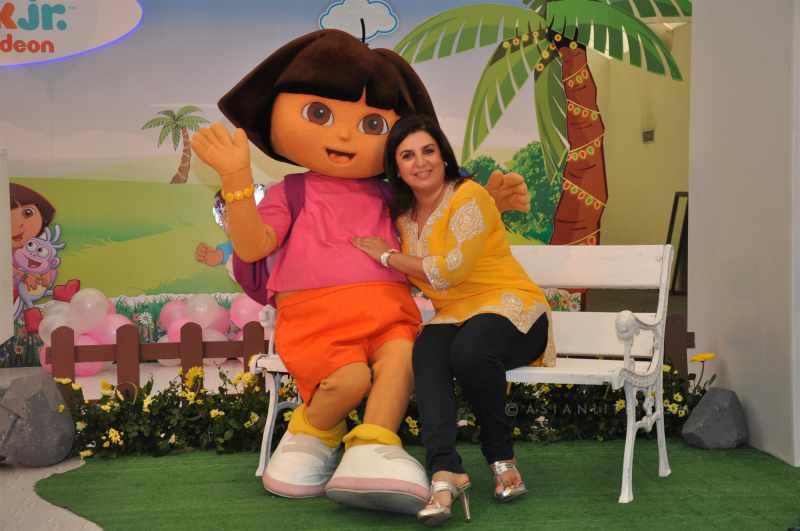 Farha Khan with a cartoon