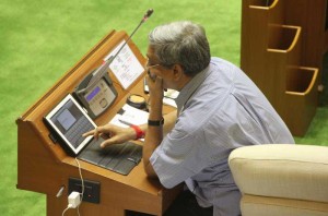 Goa Chief Minister Manohar operates a tab on the first day of Goa Assembly session which is now 95 % paperless at Goa Assembly Complex in Porvorim, Goa on July 22, 2014. (Photo: IANS)
