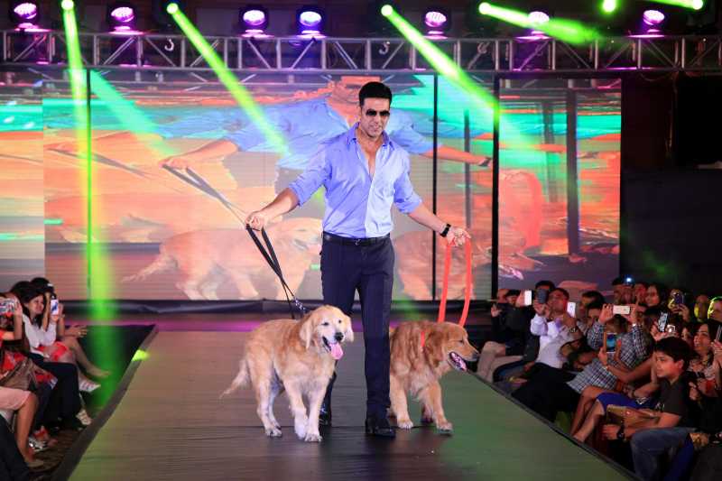 Actor Akshay Kumar walk the ramp with dogs during the promotion of film Entertainment in Bengaluru.