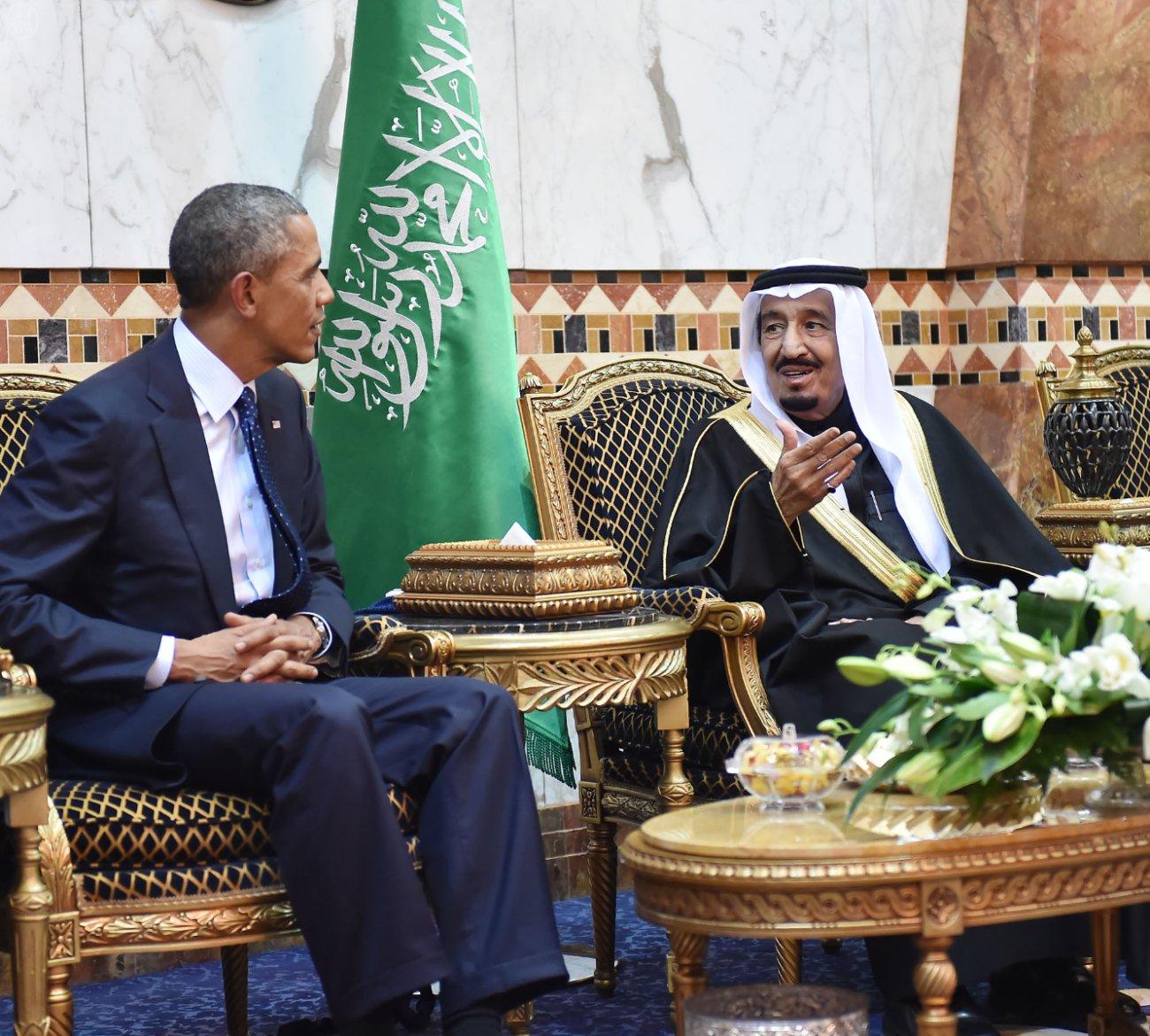 U.S. President Barack Obama talks with Saudi Arabia's King Salman bin Abdulaziz Al Saud(R) after arriving in Riyadh, Saudi Arabia, on Jan. 27, 2015. Obama cut short his visit to India to be able to visit Saudi Arabia to offer his condolences and discuss key regional and international topics. FILE PHOTO