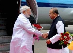 Maharashtra Governor K Sankaranarayanan receives Prime Minister Narendra Modi at Mumbai's CSIA Airport on July 21, 2014. (Photo: Sandeep Mahankal/IANS)