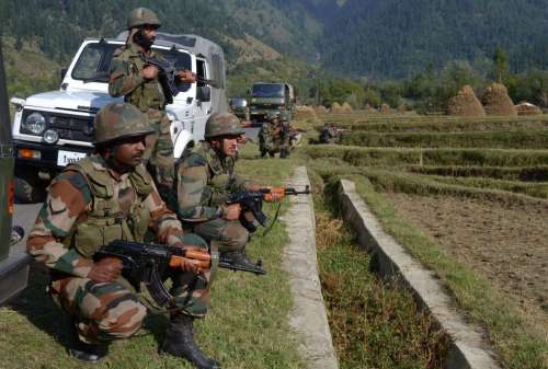 Soldiers in action during an encounter in Kupwara of Jammu and Kashmir on Sept. 30, 2014. One alleged militant was killed in the encounter. (Photo: IANS)