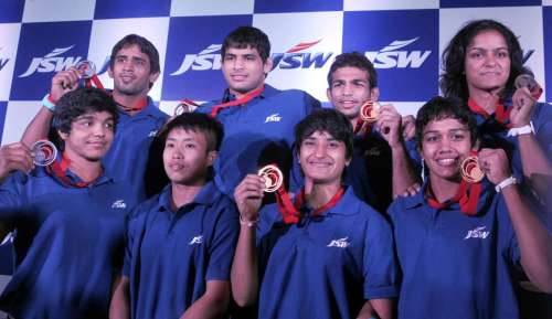 Medal winners in Glasgow 2014 Commonwealth Games Vinesh Phogat, Babita Kumari, Amit Kumar, Bajrang, Sushila Devi, Sakshi Kumar, Navjot Kaur and Pawan Kumar during a felicitation function in New Delhi on Aug 6, 2014. (Photo: IANS)