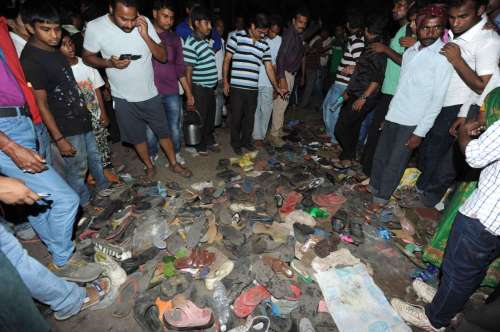 People gather at the spot where a stampede broke out at Gandhi Maidan in Patna . At least 32 people including women and children died in the stampede.