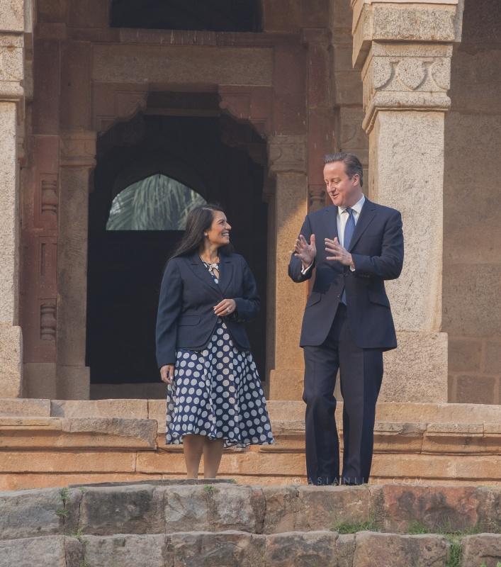 British Prime Minister David Cameron with Priti Patel MP, Minister of State for Employment at the Department for Work and Pensions