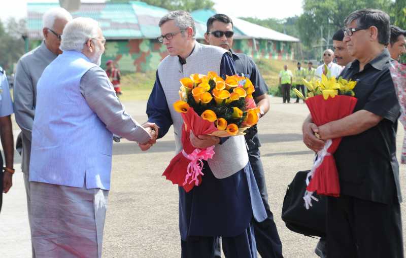 Prime Minister Mr Narendra Modi being received by the Chief Minister of Jammu and Kashmir, Mr Omar Abdullah, on his arrival at Jammu airport, in Jammu and Kashmir  