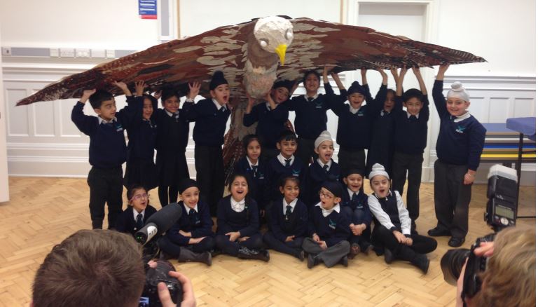 Students of Falcon Primary School with their falcon bird 