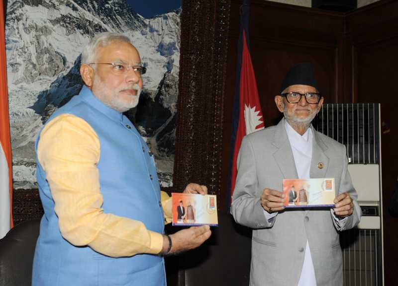 The Prime Minister, Shri Narendra Modi with the Prime Minister of Nepal, Shri Sushil Koirala releasing the commemorative of stamps, at Chambers, PMO, Singha Darbar, in Kathmandu, Nepal on August 03, 2014.