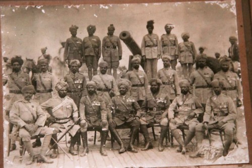 Sepoys and officers of Dulmial pose with the cannon