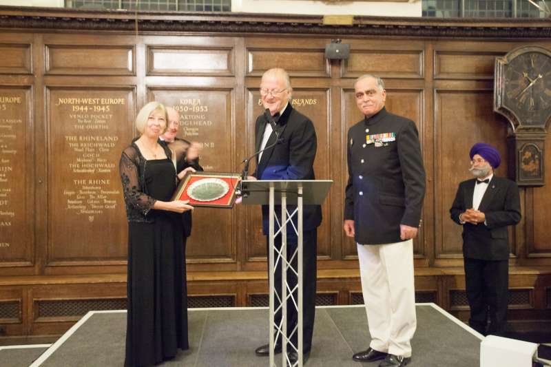  Lt Gen T S Shergill PVSM, former Colonel of the Regiment of the Deccan Horse and Scinde Horse, presents the silver salver to Janice Murray, Director General at the NAM 