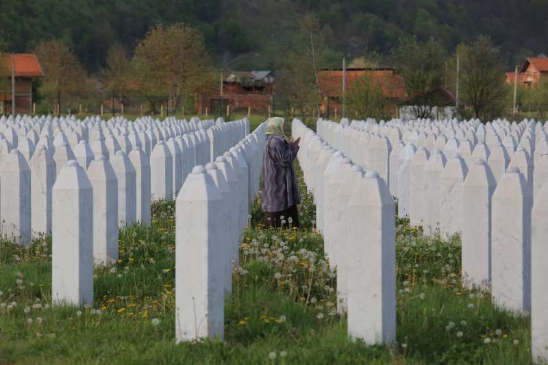 A mother prays at the memorial for Srebrenica victims 